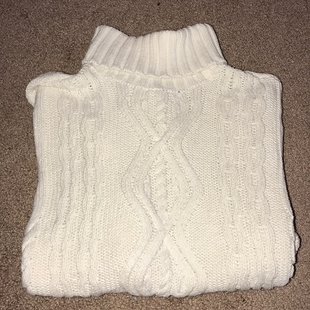 White cable knit sweater.